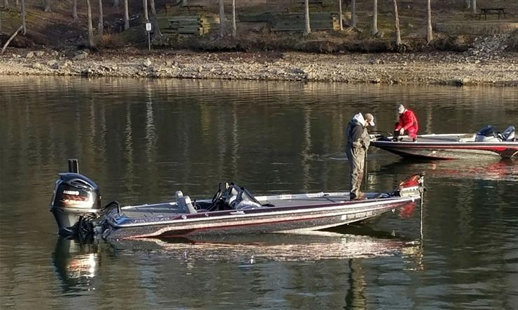 Student fishing on a boat